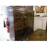 A mahogany glazed bookcase