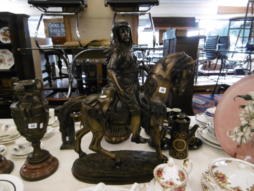 A bronze sculpture of Bedouin on horseback