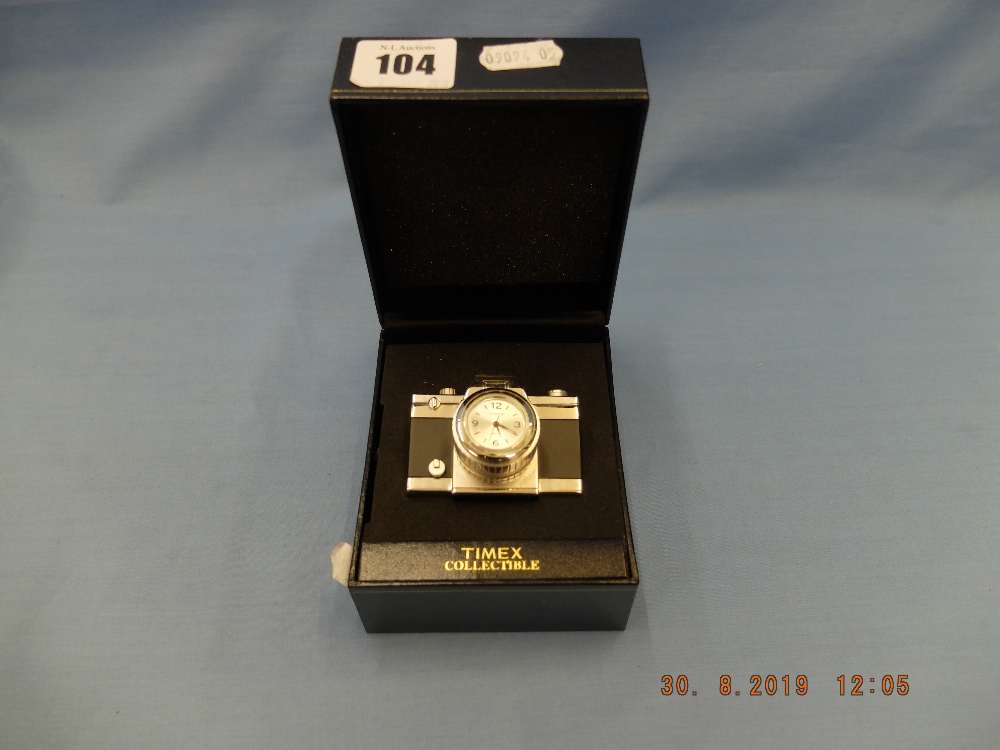 A miniature Timex novelty clock in form of a camera