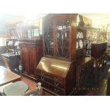 A mahogany bureau bookcase