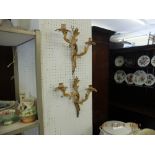 A pair of gilt two branch wall sconces