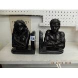 A pair of bronze figural bookends