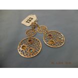 A pair of gemstone set 14ct gold earrings