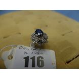 A platinum, diamond and sapphire floral ring,