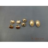 Four pairs of silver clip earrings
