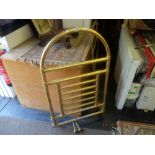 A brass heated towel rail