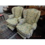 A pair of wing armchairs