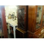 A mahogany bookcase on cupboard base