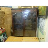 A mahogany glazed bookcase