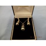 A pair Tahitian pearl and diamond drop earrings and matching necklace set in 18ct gold, 1.5ct.