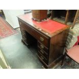 A mahogany leather topped desk