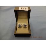 A pair of platinum sapphire and diamond earrings