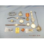 An assortment of watches including a silver fob watch