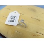 An 18ct hallmarked ring set with diamond, size M,