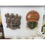 A hand painted Indian mask and a Burmese carving