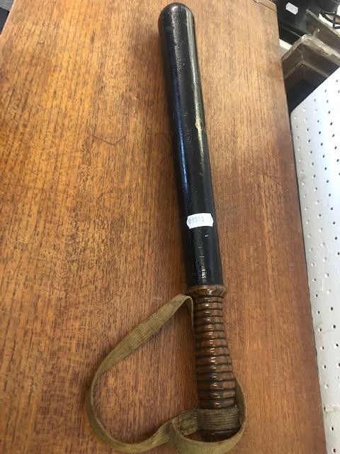 A Victorian turned wood truncheon painted with crown over "Wilts Constabulary" on a black ground