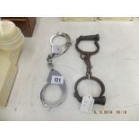 A Victorian pair of handcuffs and a 1960s pair of Hiatt handcuffs