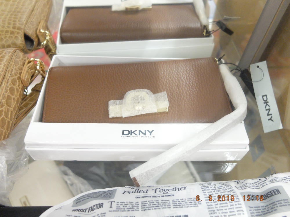 A DKNY purse - colour- Luggage in leather, code: 215, brand new unused, still has labels etc.