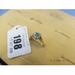 An 18ct gold green gem stone and diamond ring