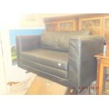 A black leather sofa bed