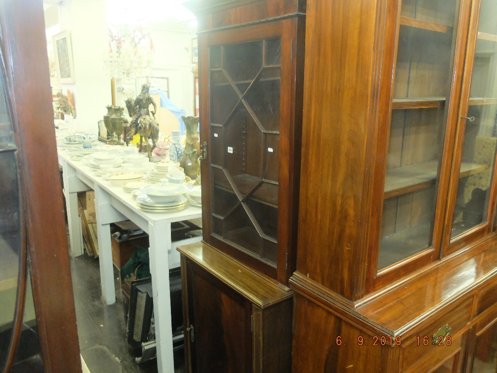 A mahogany bookcase on cupboard base