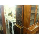 A mahogany bookcase on cupboard base