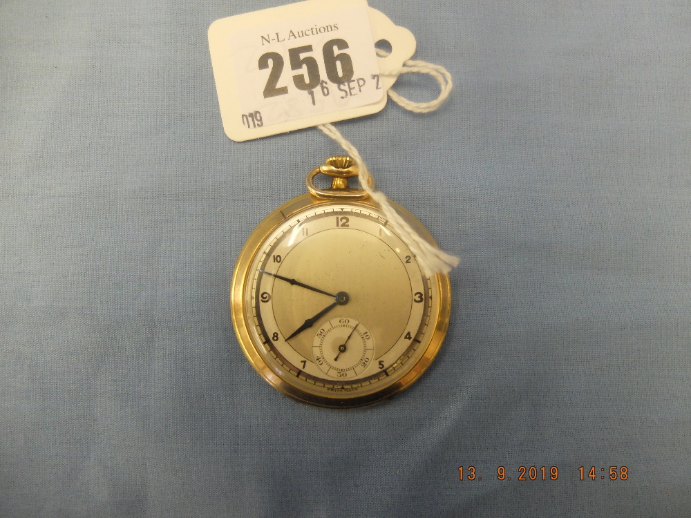 An art deco 9ct gold ope faced slim line pocket watch