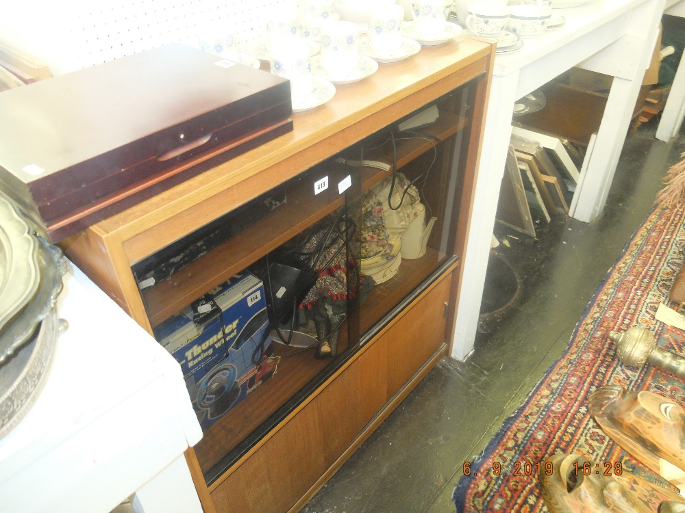 A SMOKED GLASS CABINET