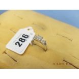 A twelve stone princess cut diamond cluster ring, .