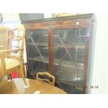 A mahogany glazed bookcase