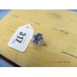 An 18ct white gold, wire cluster ring, set with diamond and sapphire,
