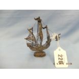 A white metal model of a galleon