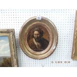 An oval gilt framed portrait of an old man
