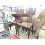 A pair of 19th century mahogany hall chairs