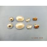 Four pairs of silver clip earrings