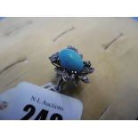 A vintage turquoise and diamond dress ring unmarked white metal