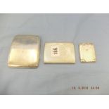 Two hallmarked silver cigarette cases and a match case