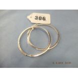 A pair of 18ct HM white gold hoop earrings, 70 diamonds approx. 2cts weighs 15.