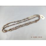 A long cultured pearl necklace