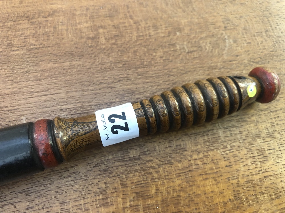 A Victorian turned wood truncheon painted with a rampant lion supporting word "Don" over "VR" on a