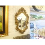 A gilt framed mirror