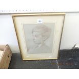 A gilt framed sketch of a boy