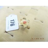 A yellow metal and coral floral ring marked 750 weight 8 grams,