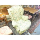 A wing back armchair