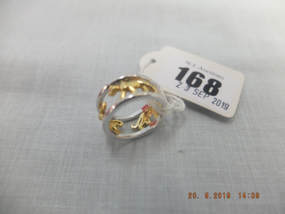 A yellow and white metal diamond set lion ring weight 10 grams, marked 750,