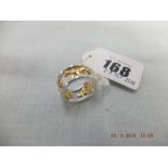 A yellow and white metal diamond set lion ring weight 10 grams, marked 750,