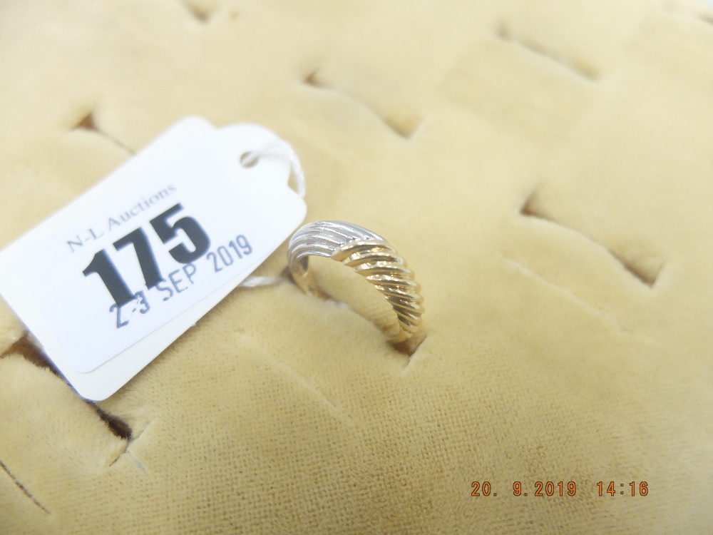 A yellow and white metal ring marked 750 Cartier weight 4 grams,