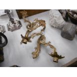 A pair of gilt two branch wall sconces