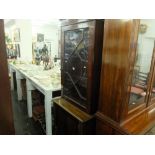 A mahogany bookcase on cupboard base