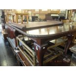 A mahogany extending dining,